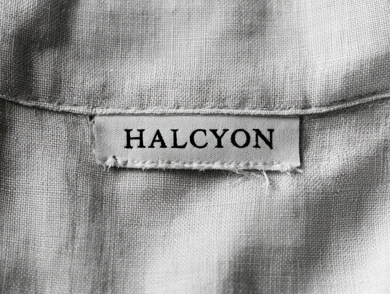 Halcyon — a woven HALCYON label stitched inside the collar of a linen garment