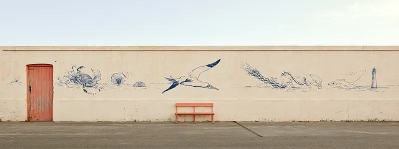 The Gannet — a harbour wall mural of a diving gannet, crab, shells and lighthouse in navy line