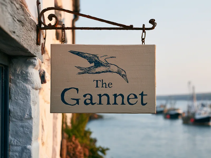 The Gannet — the hotel's hanging sign, a diving gannet above the hand-lettered name